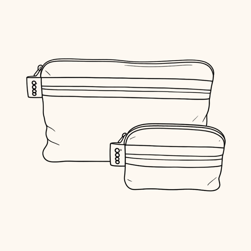 A silver foil zippered pouch  pocket with two horizontal stripes, one hot pink and one orange, on a light grey background.  Used to organise your everyday bag.